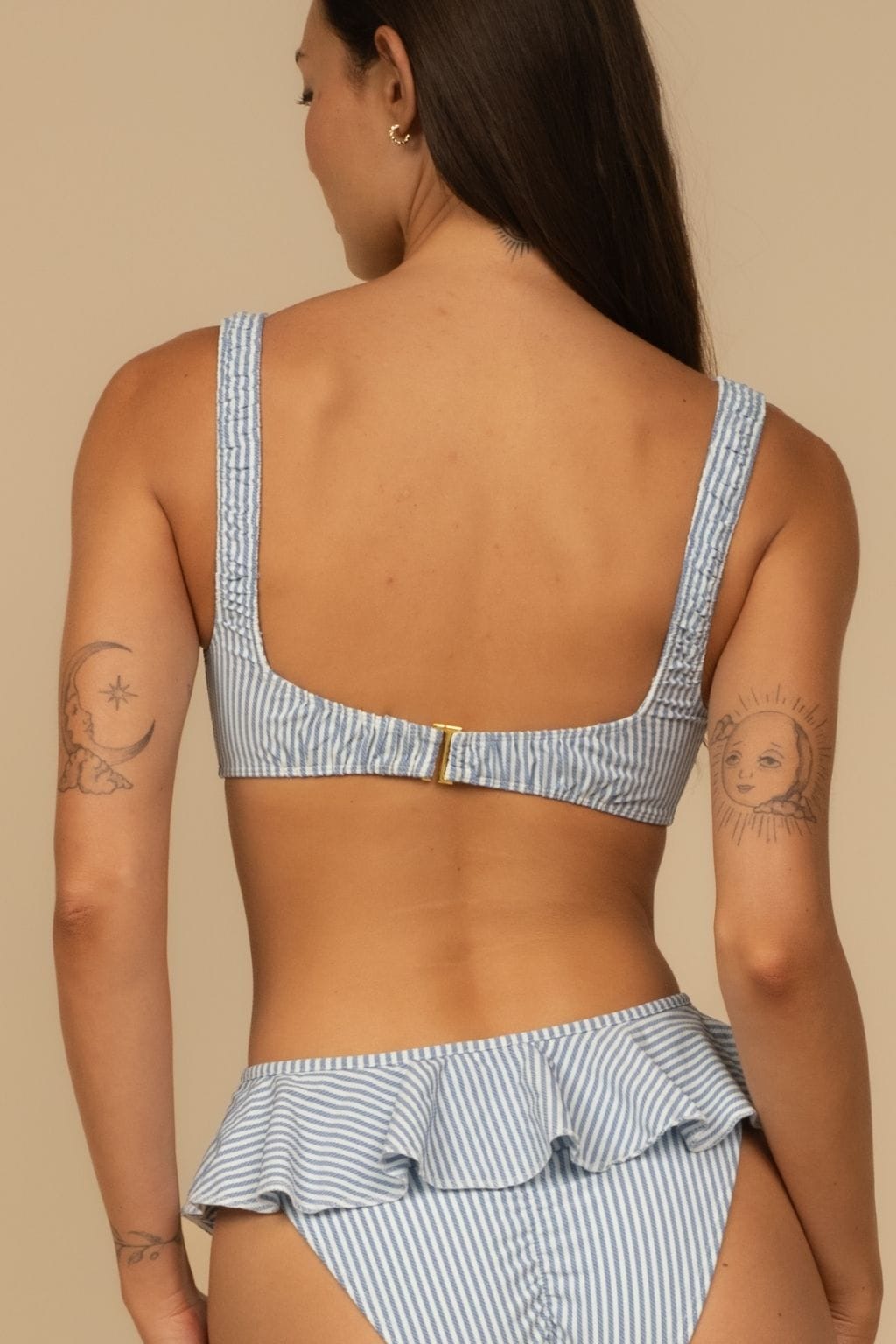 Blue and white striped bikini top with adjustable straps and back clasp closure.