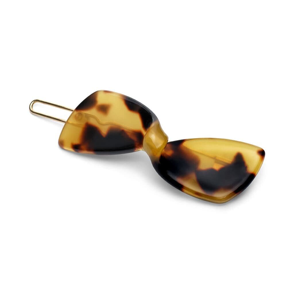 Tortoiseshell acetate hair pin with two rounded rectangular panels connected by a metal clasp.