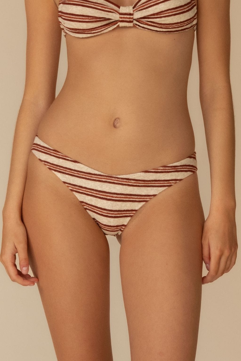 Burgundy and cream striped bikini bottom with zig-zag stitching detail and low-rise fit.