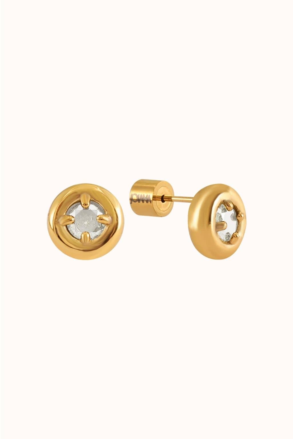 Pair of small gold stud earrings with clear crystal centers and gold posts.