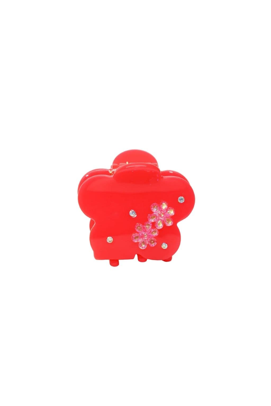 Red flower-shaped hair clip with pink rhinestone flower decoration and clear crystal accents.