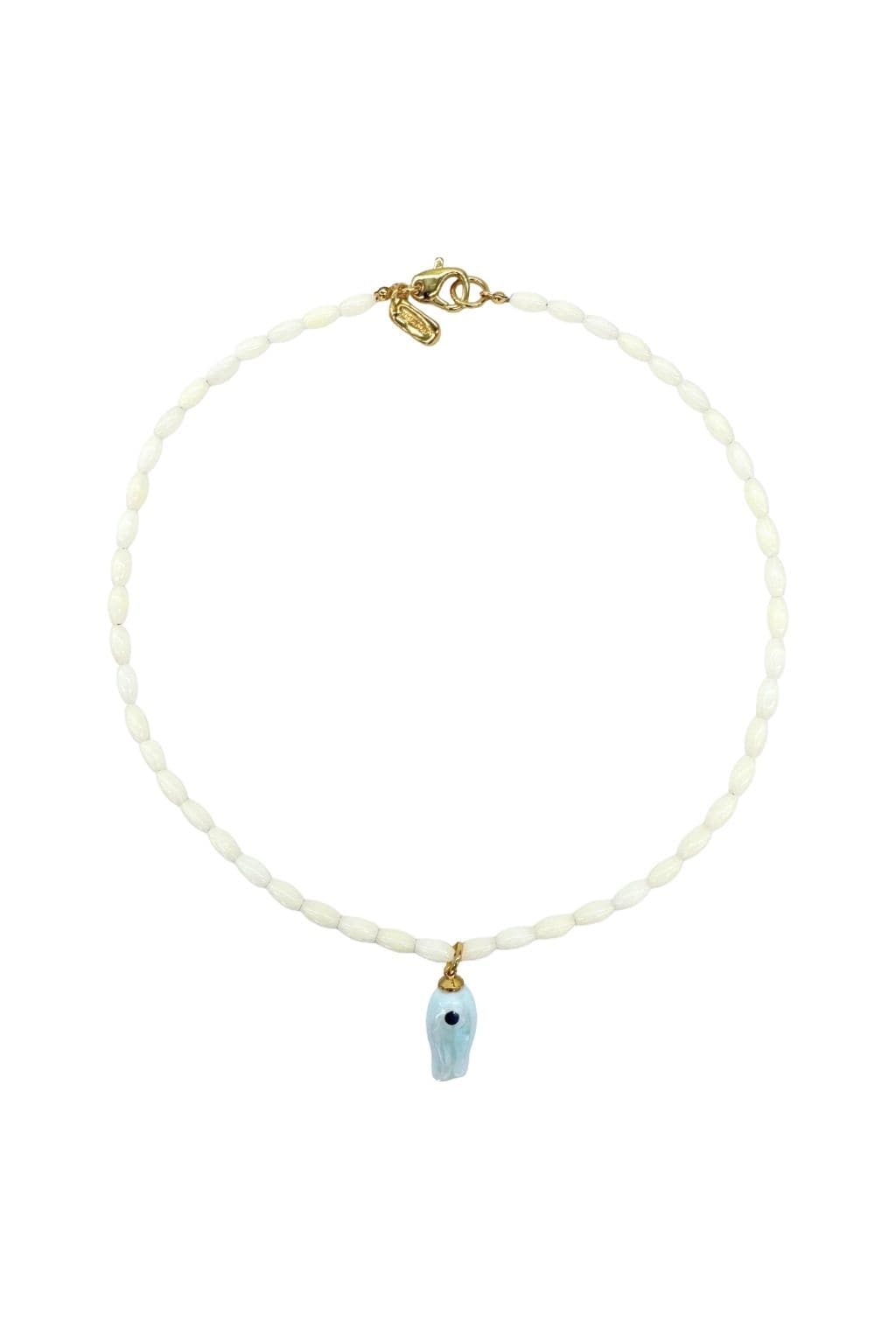 Necklace with cream mother-of-pearl barrel beads, pale blue fish-shaped pendant with black eye, and gold-tone toggle clasp.