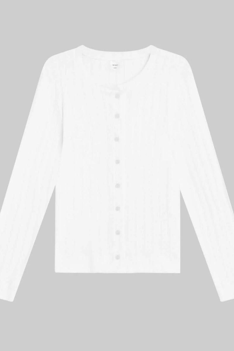 White pointelle crew cardigan with long sleeves and button front closure.
