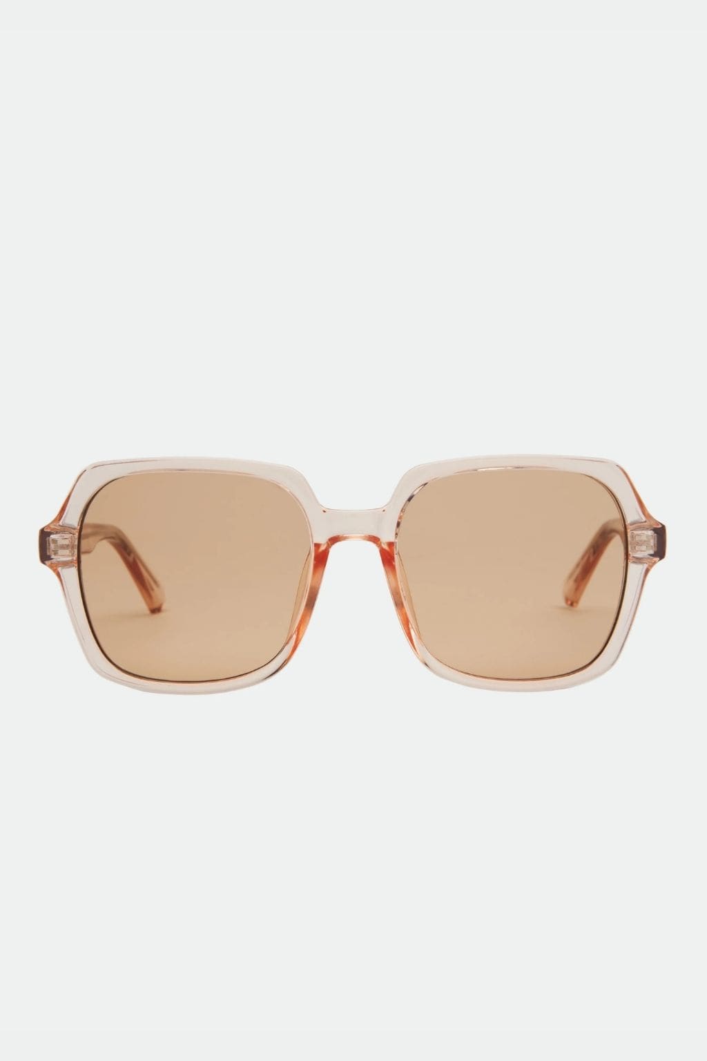 Translucent beige and brown square sunglasses with amber-tinted lenses and brown acetate arms.
