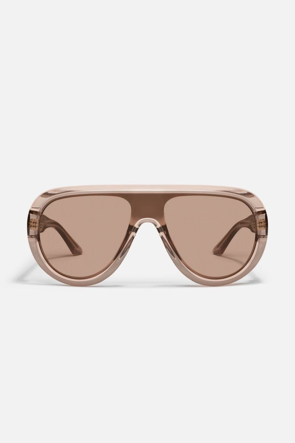 Oversized sunglasses with tan translucent frame and brown-tinted lenses.
