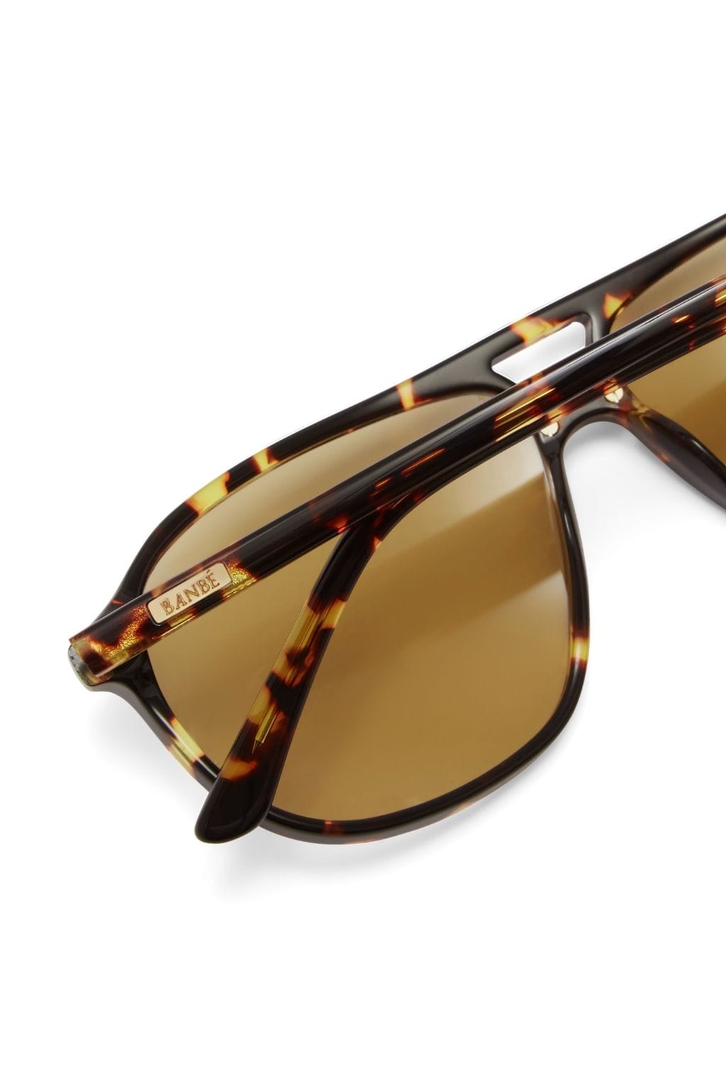 Amber tortoise acetate sunglasses with yellow-tinted lenses and black temple arms.