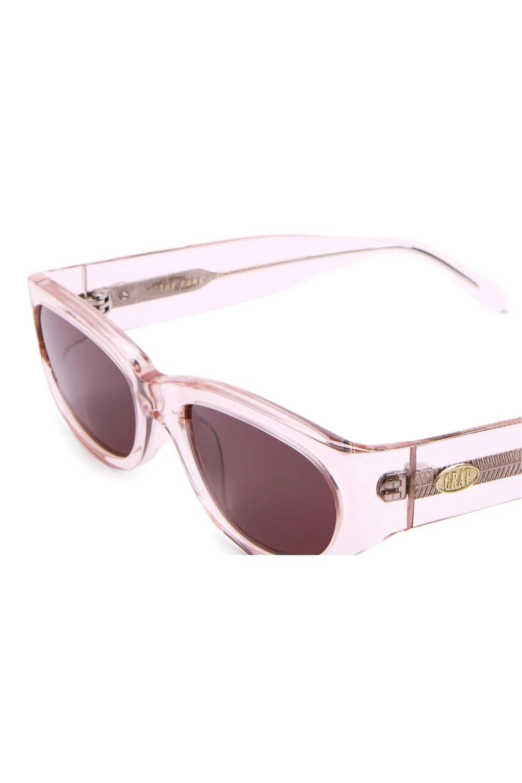 Crystal rose pink oval sunglasses with plum-tinted lenses and textured side details.