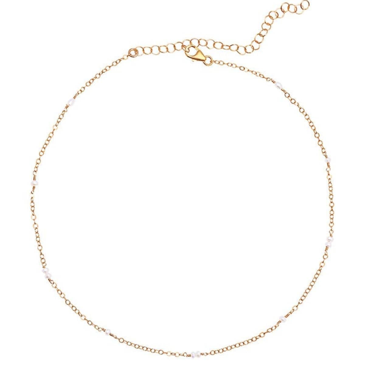 Gold-tone chain choker necklace with small white beads spaced throughout and adjustable lobster clasp closure.