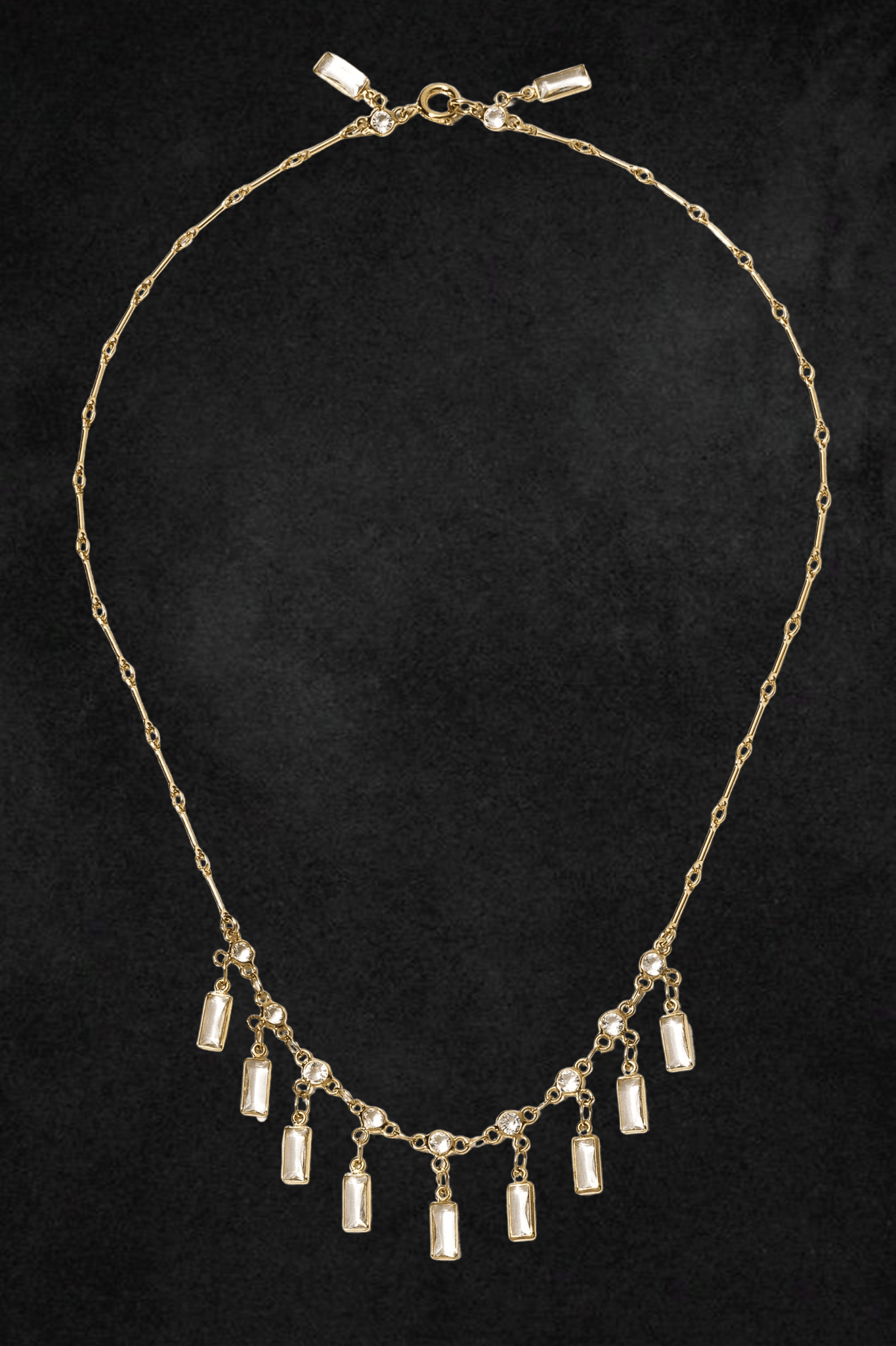 Gold-tone chain necklace with rectangular cubic zirconia pendants and round crystal accents, featuring a clasp closure.