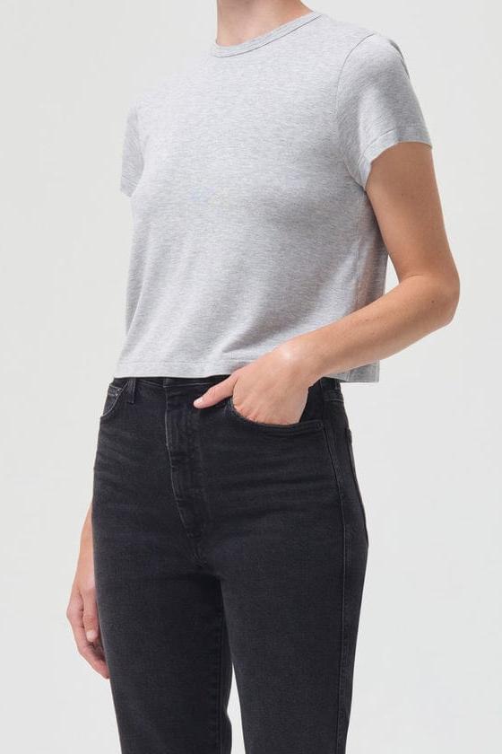Grey heather short-sleeve crewneck tee with fitted silhouette on model wearing black jeans.