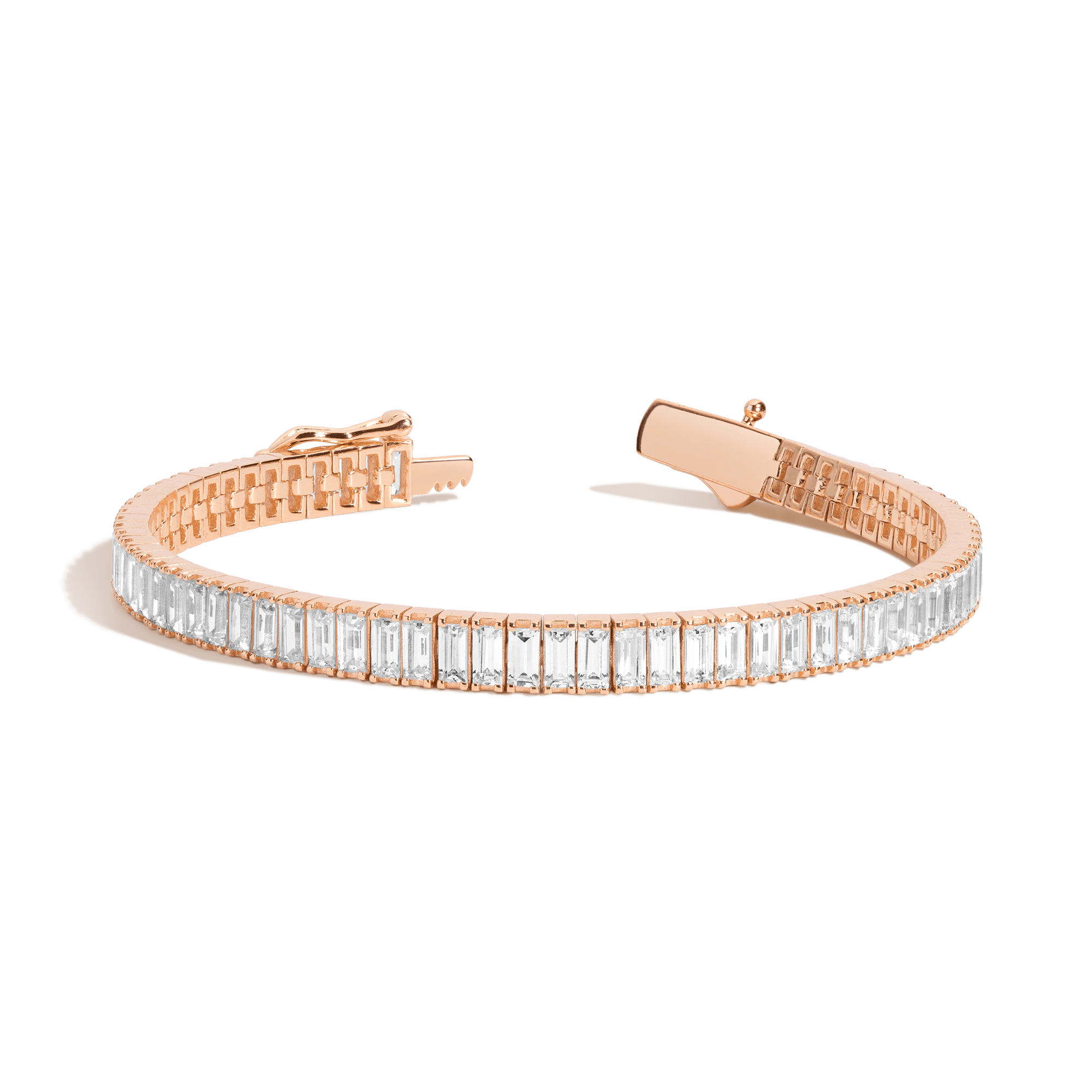Rose gold tennis bracelet with rectangular clear stones set in a continuous row along the band with a box clasp.