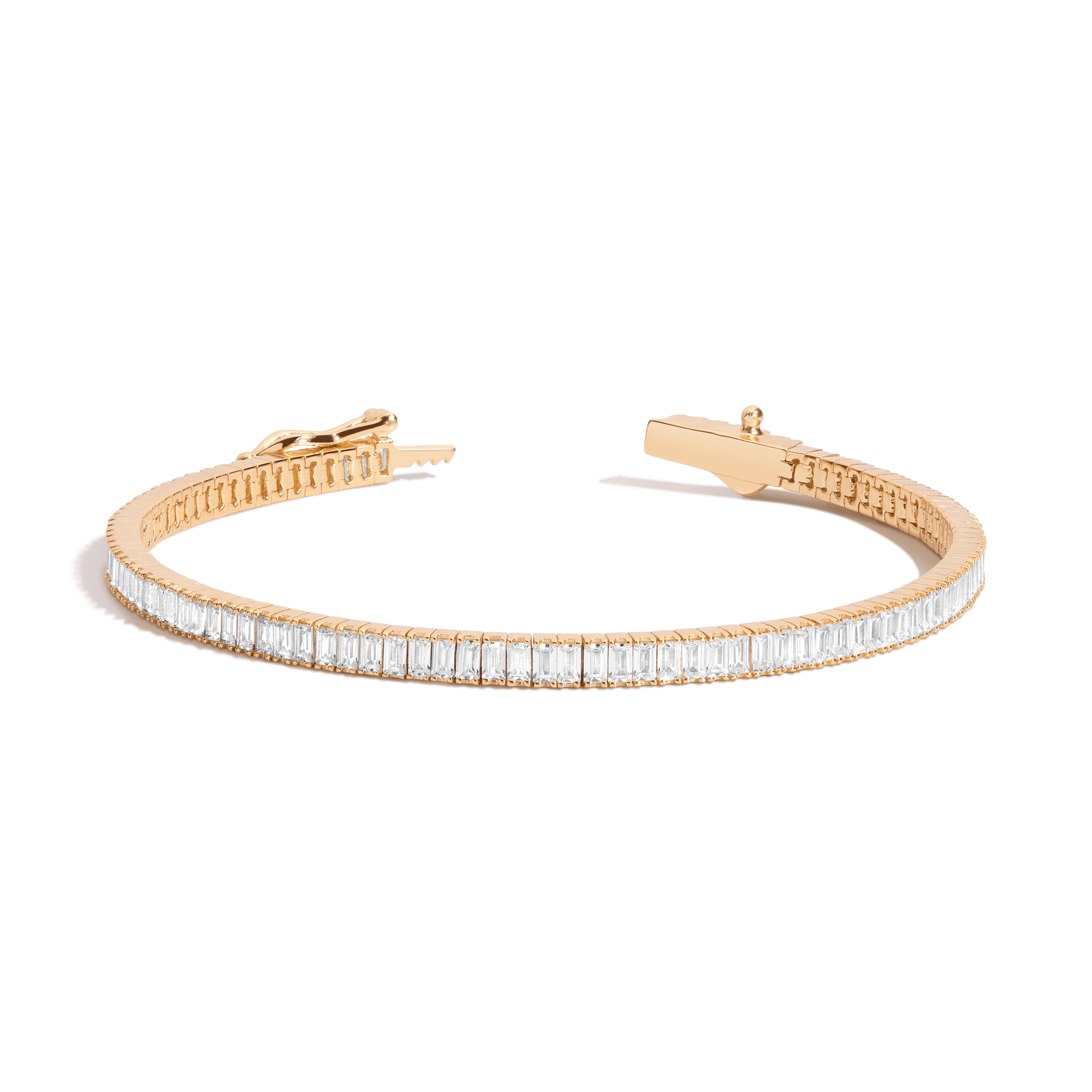 Gold-tone tennis bracelet with rectangular white stones set in a continuous line along the band.