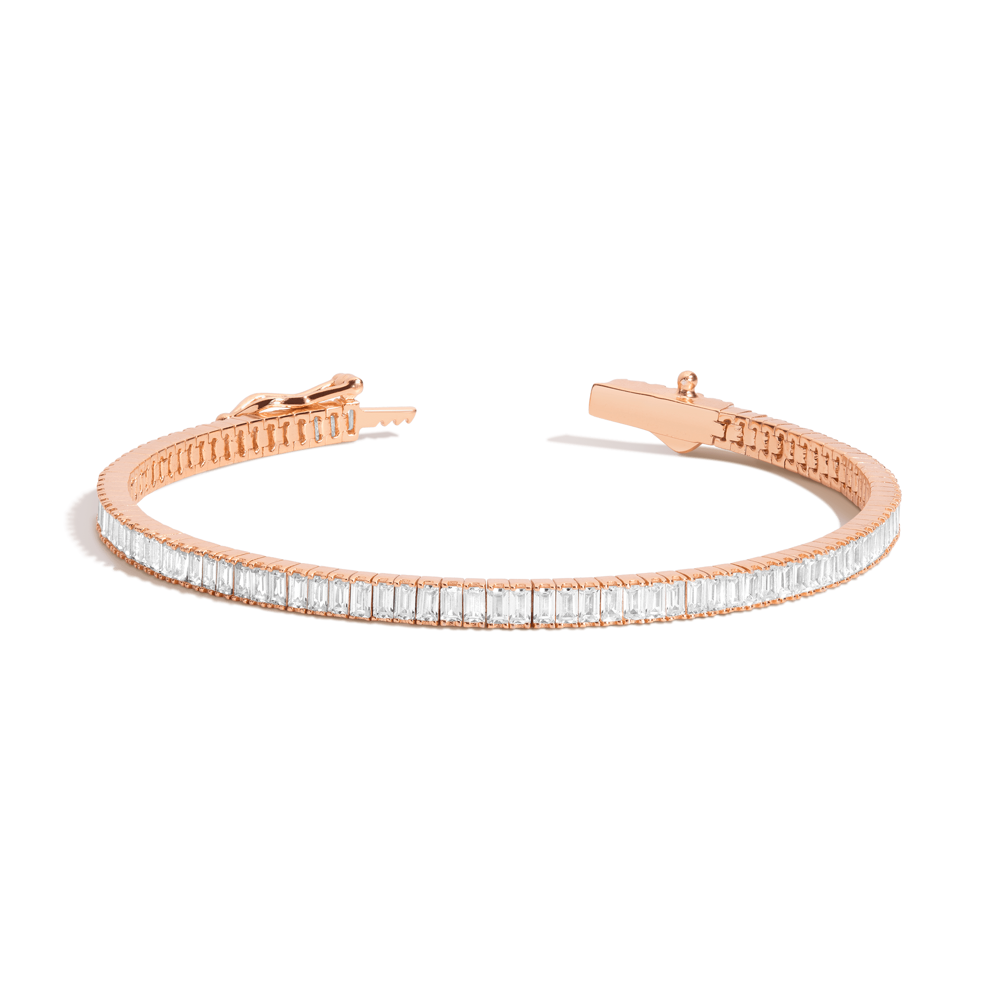 Rose gold tennis bracelet with rectangular white stones set in a continuous line and hinged clasp.
