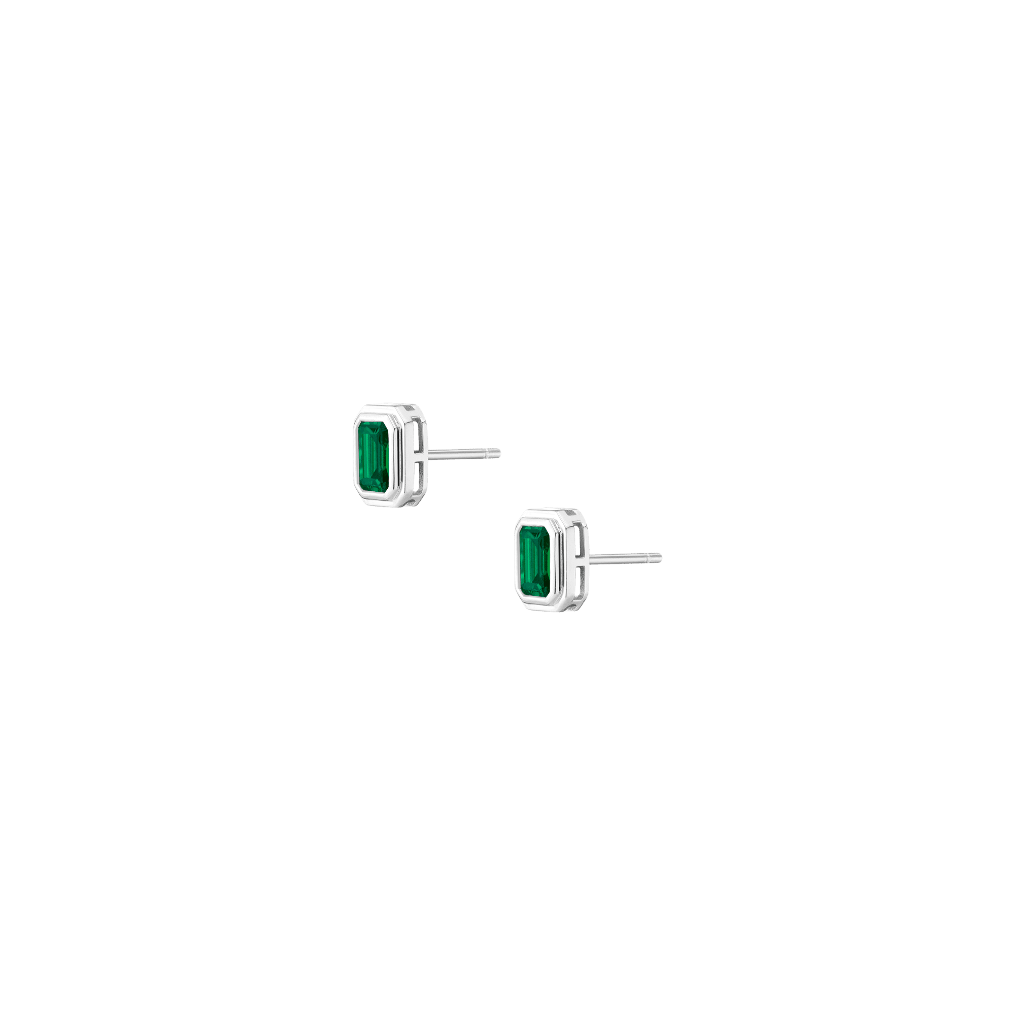 Pair of stud earrings with rectangular green emeralds set in silver-toned metal frames with straight posts.