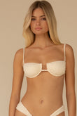 Cream textured bikini top with underwire cups, thin shoulder straps, and center keyhole cutout detail.
