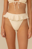Cream textured bikini bottom with ruffle detail and drawstring waist tie.