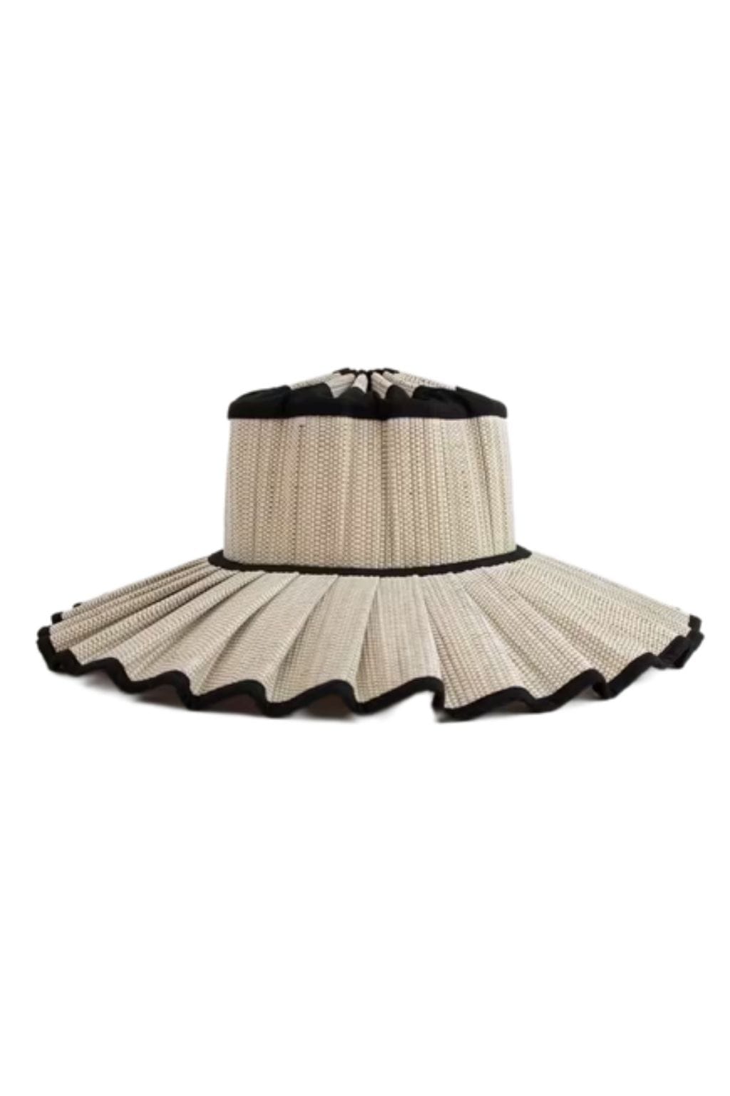 Cream and black wide-brimmed capri hat with textured knit fabric and ruffled scalloped brim edging.