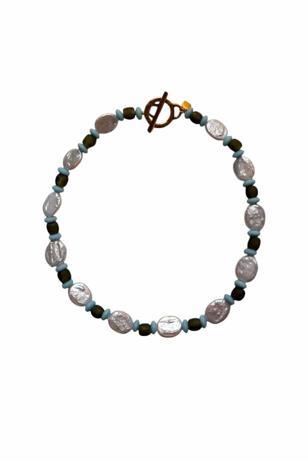 A beaded necklace with oval white pearls, olive green beads, light blue spacers, and a gold toggle clasp at the top.