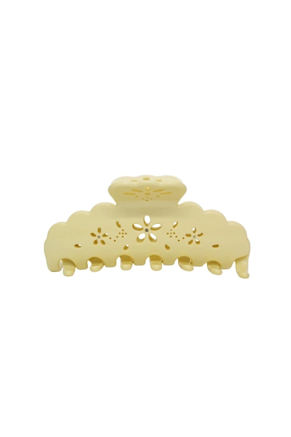 Large pale yellow hair clip with scalloped edges and floral eyelet cutout design.