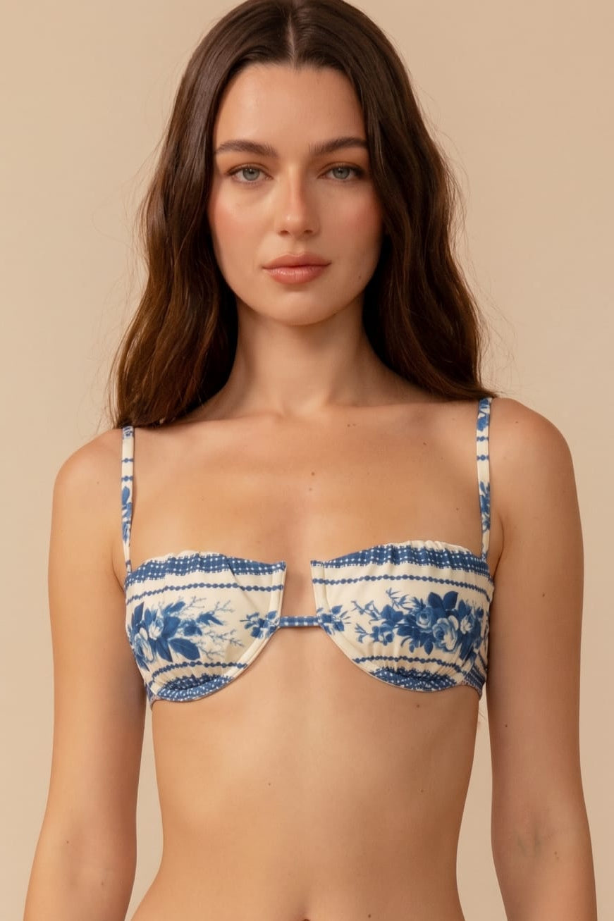 Blue and white toile stripe bikini top with petal-shaped cups and adjustable spaghetti straps.