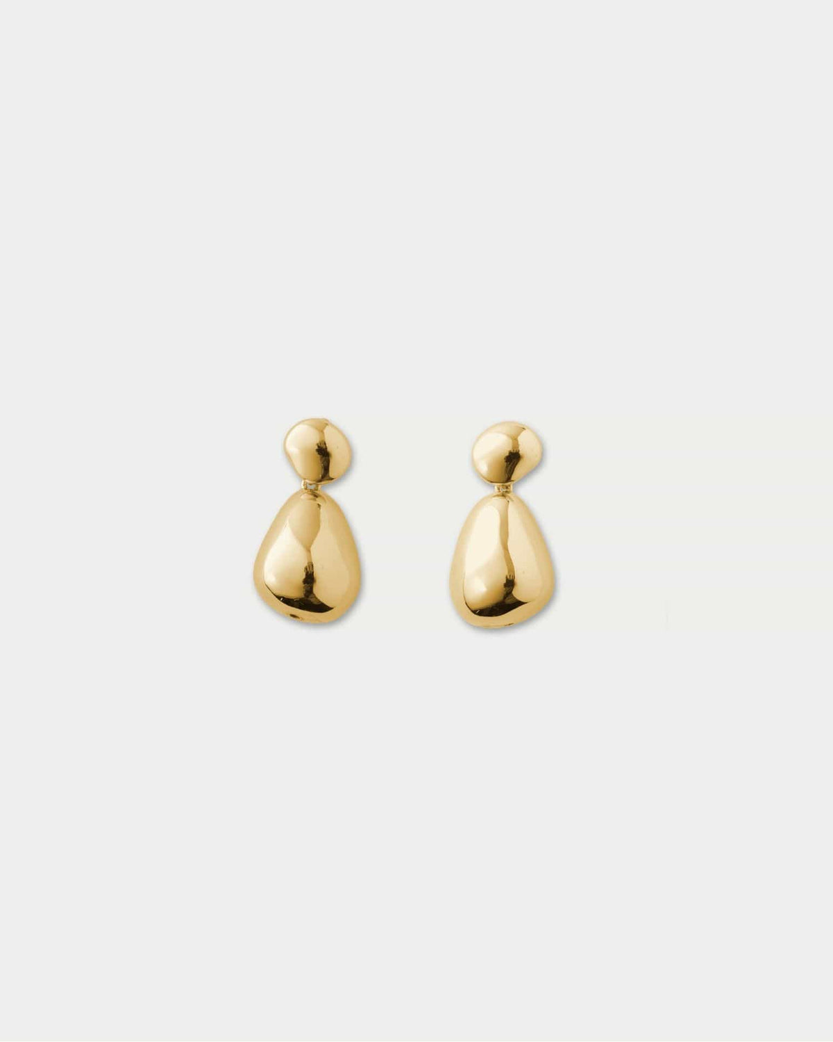 Pair of gold-toned drop earrings with polished spherical studs and teardrop-shaped pendants.