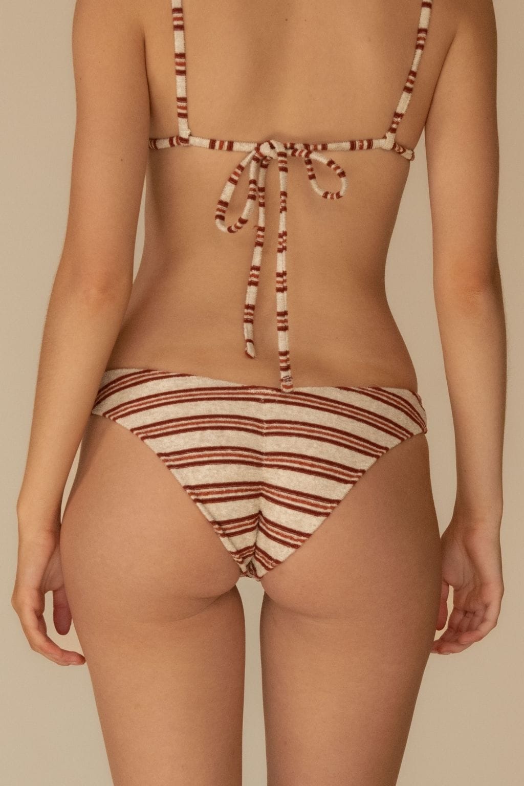 Cream and burgundy striped bikini bottom with gathered center detail and horizontal zig-zag stitching.