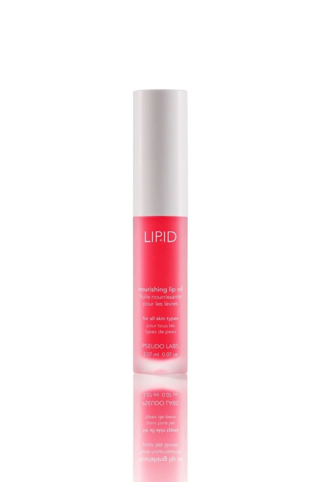 Tall cylindrical tube with white cap and pink liquid labeled "LIPID nourishing lip oil" by Pseudo Labs, 2.07 ml size.
