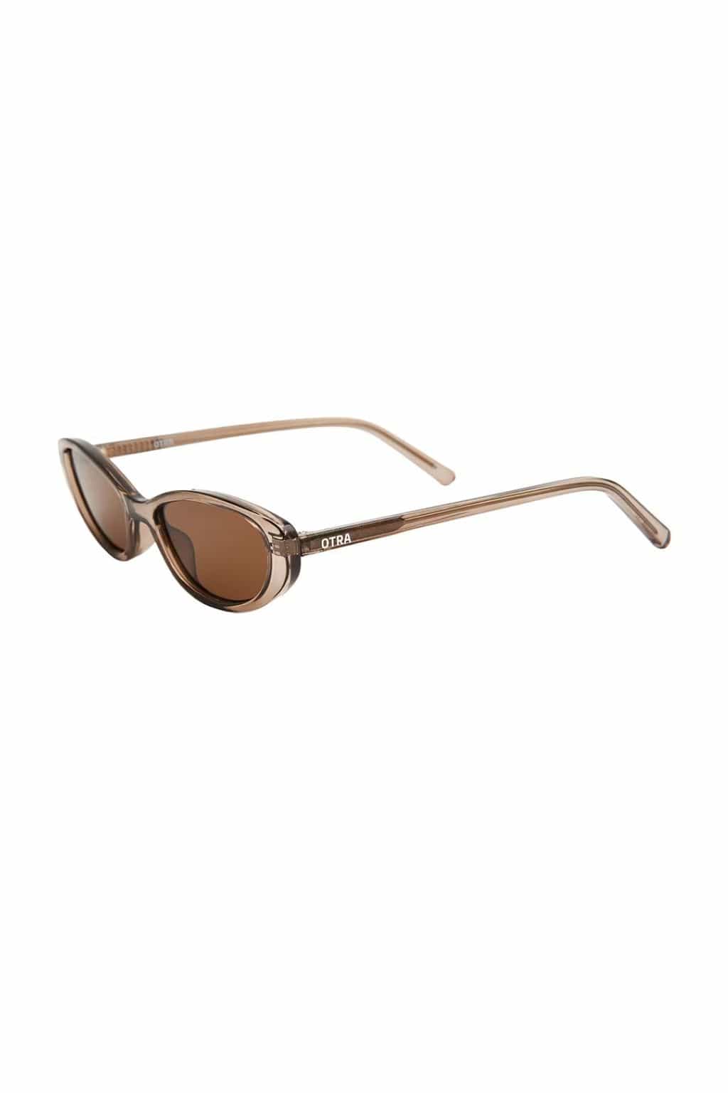 Oval sunglasses with translucent olive-brown frames and brown tinted lenses.