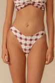 Maroon and cream plaid bikini bottom with curved waistband and diamond pattern design.