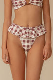 Maroon and cream plaid bikini bottom with ruffled waistband and drawstring tie.