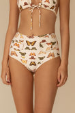 High-waisted bikini bottom with multicolored butterfly print on cream background and side pocket details.