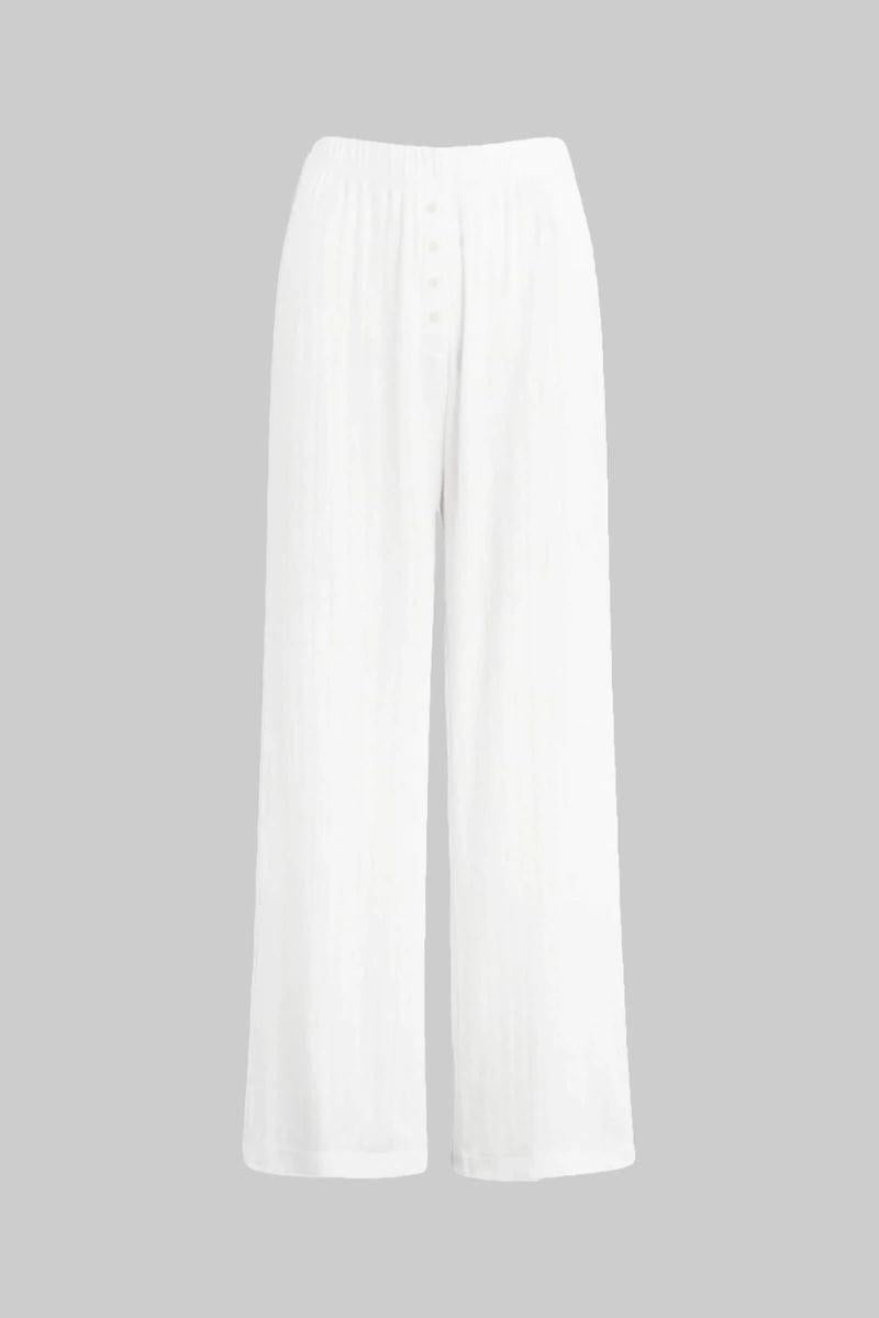 White pointelle boxer pant with button front and wide-leg silhouette.