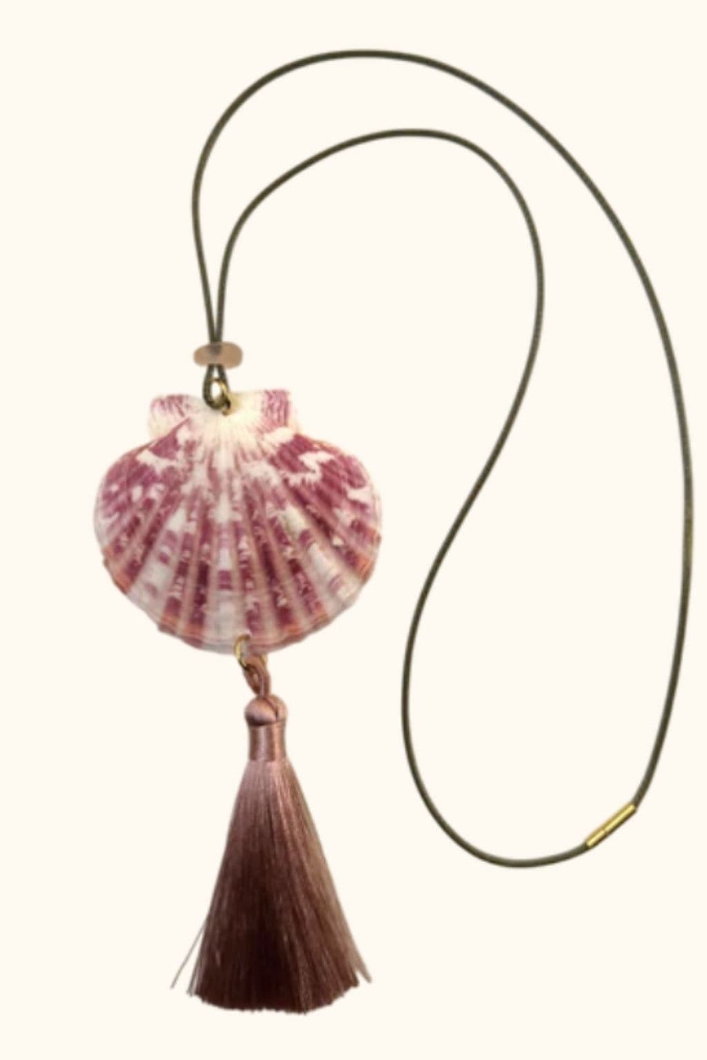 Rose-pink shell pendant with tassel hanging from olive cord necklace.