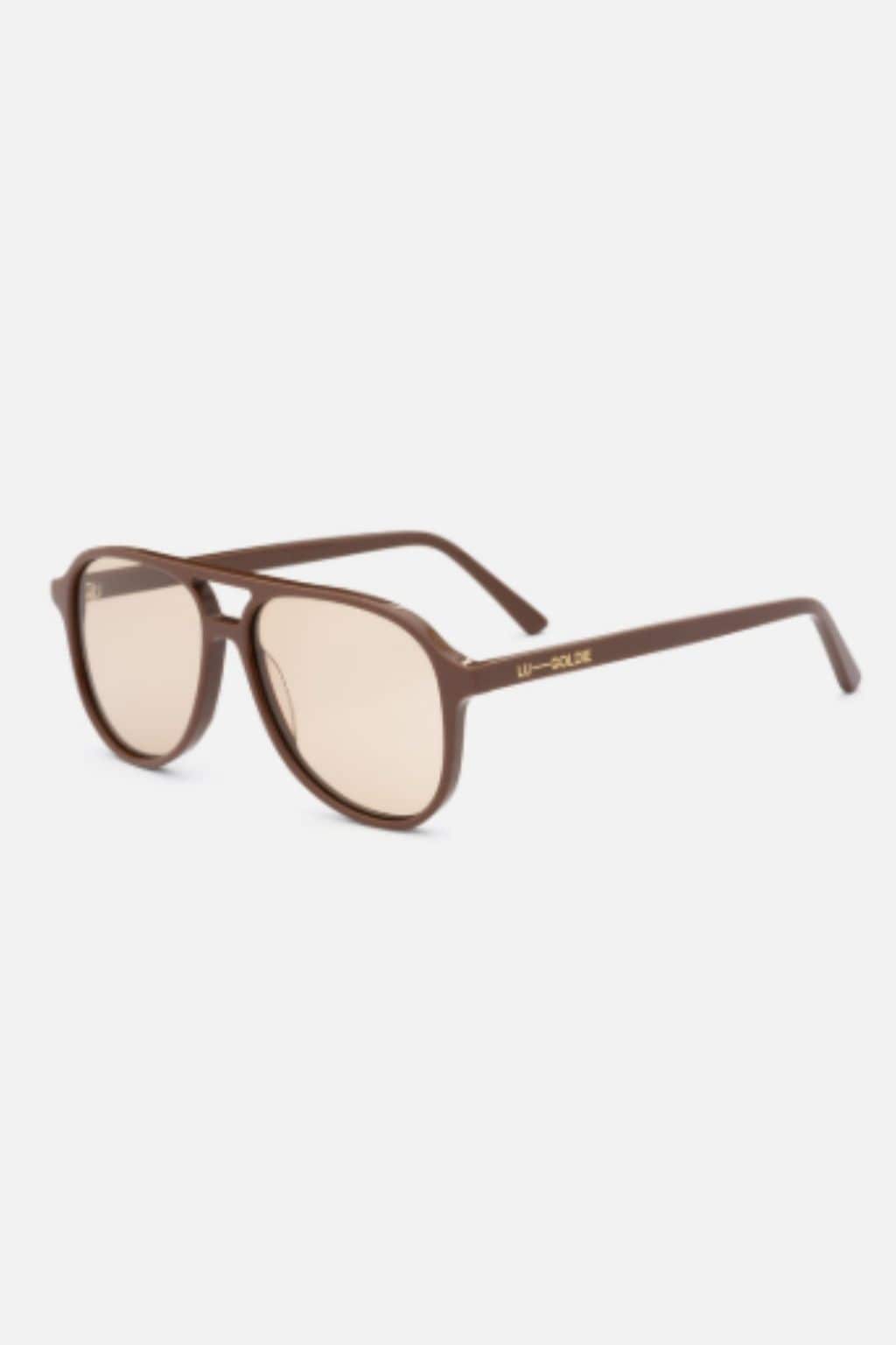Cinnamon-brown aviator sunglasses with light-tinted lenses and curved arms.