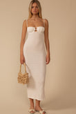 White textured slip dress with thin straps, keyhole cutout at bust, and ankle length.