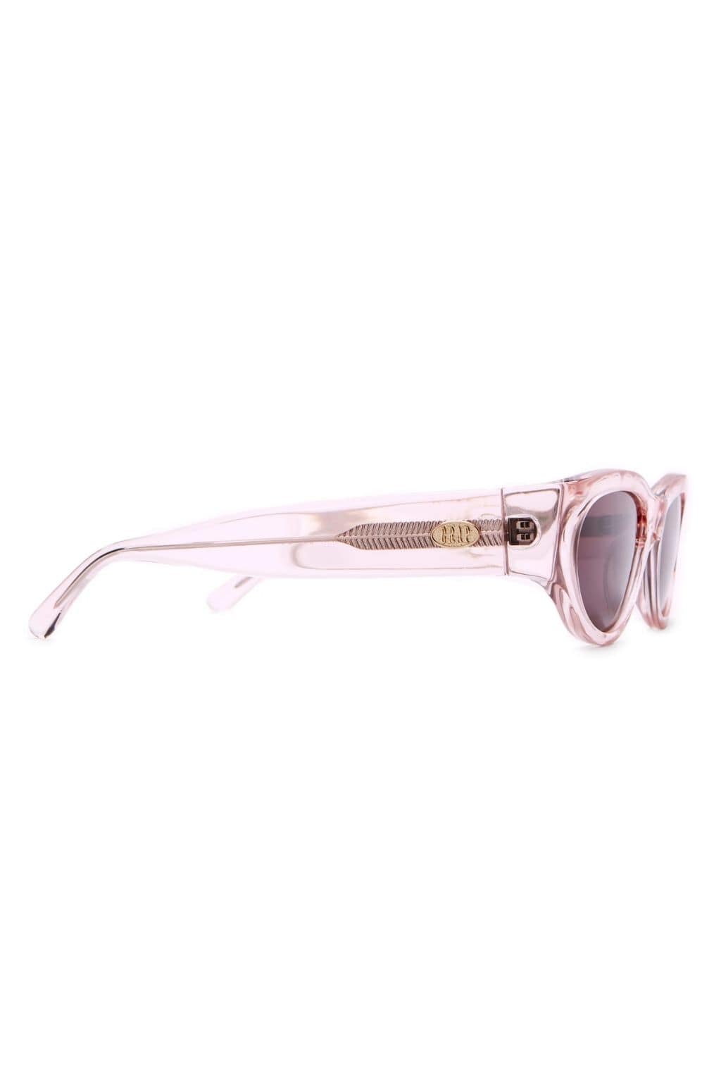 Crystal rose pink round sunglasses with textured metal bridge detail and dark tinted lenses, shown from side profile.