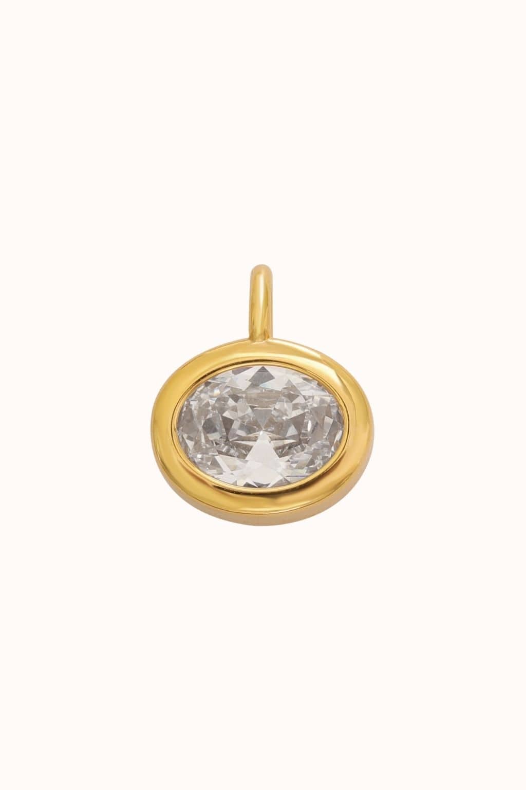 Gold charm with oval clear crystal stone set in bezel setting and loop attachment.