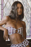 Maroon and white plaid bandeau bikini top with bow-tie center detail, shown on model.