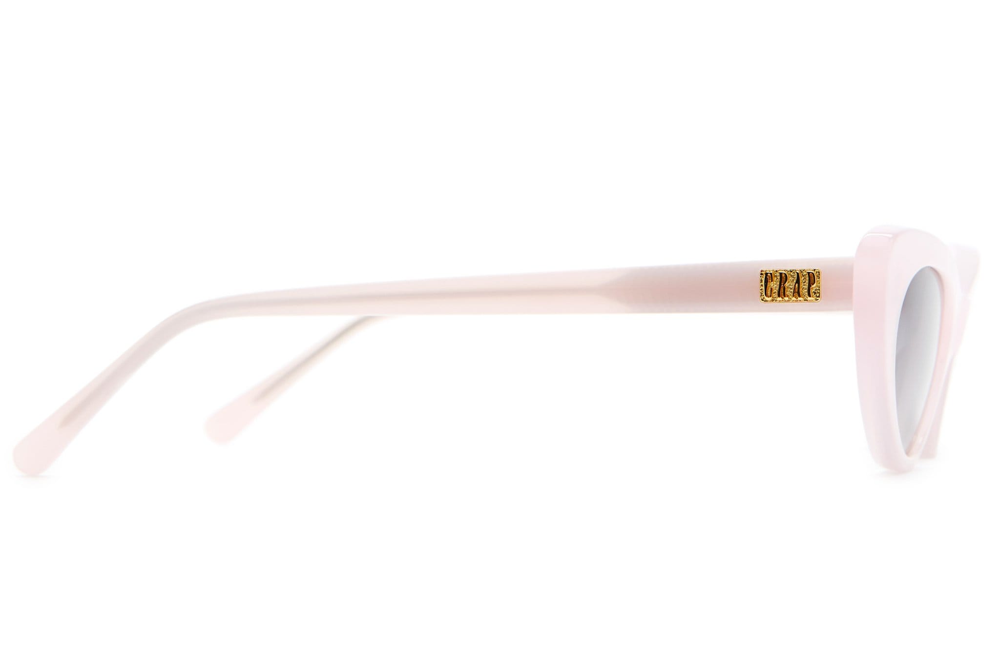 Cotton candy pink oval sunglasses with gold-tone temple detail and white lenses.